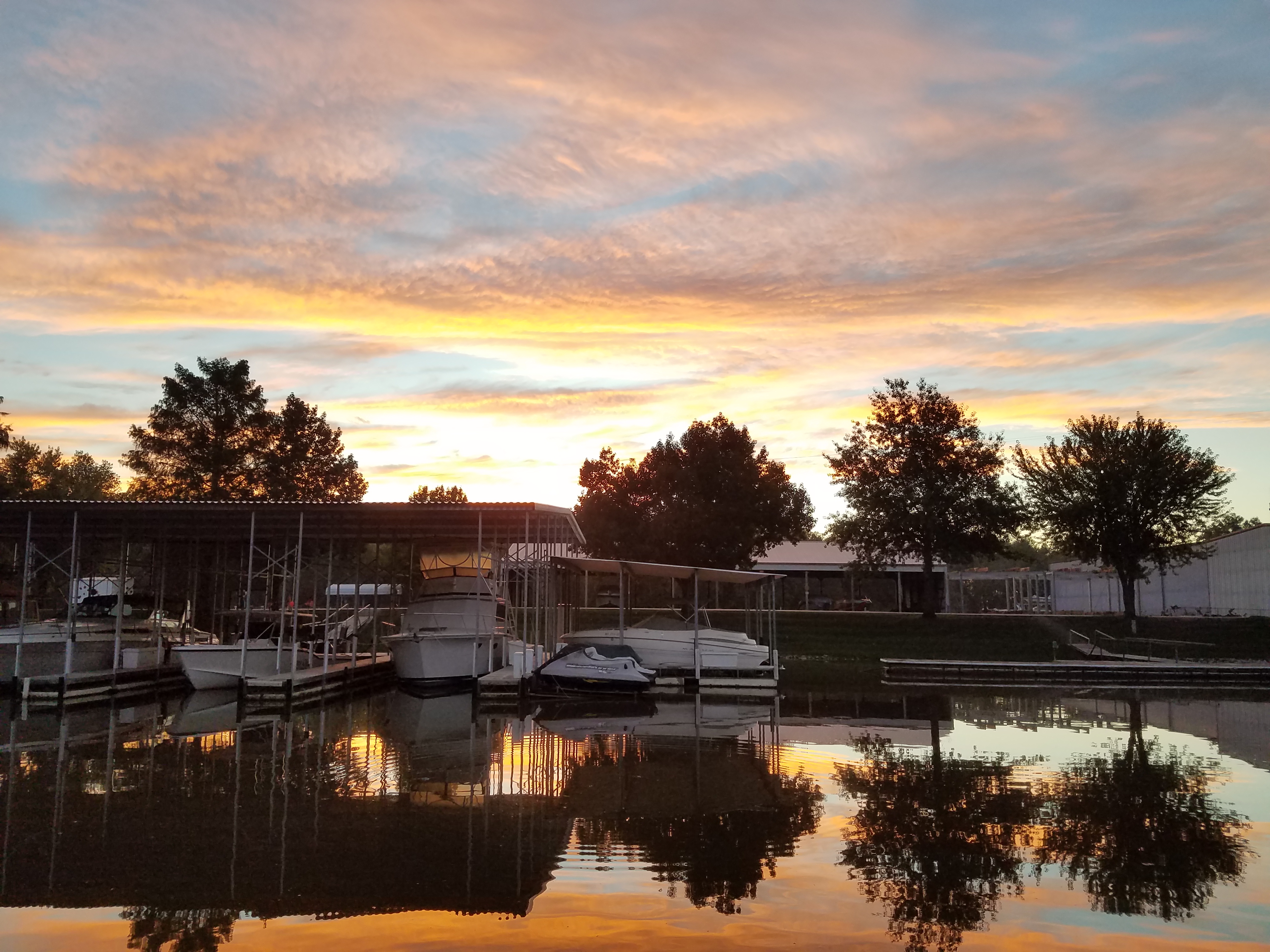 Lake Center Marina sunset slip reflections